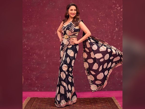 Bollywood Actress Madhuri Dixit In Black Saree And Yellow Lehenga Look