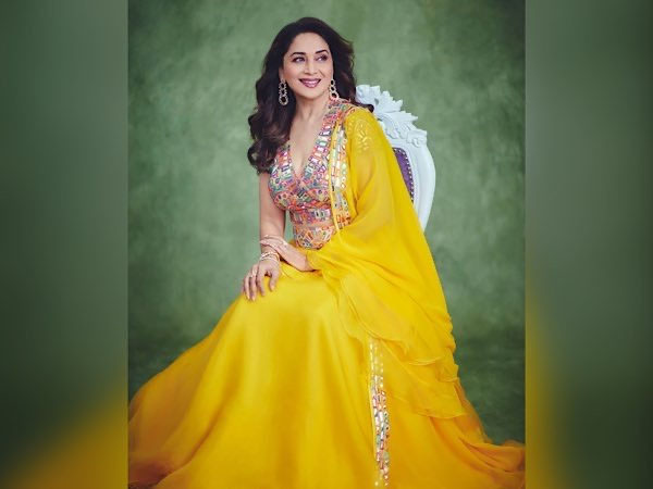 Bollywood Actress Madhuri Dixit In Black Saree And Yellow Lehenga Look