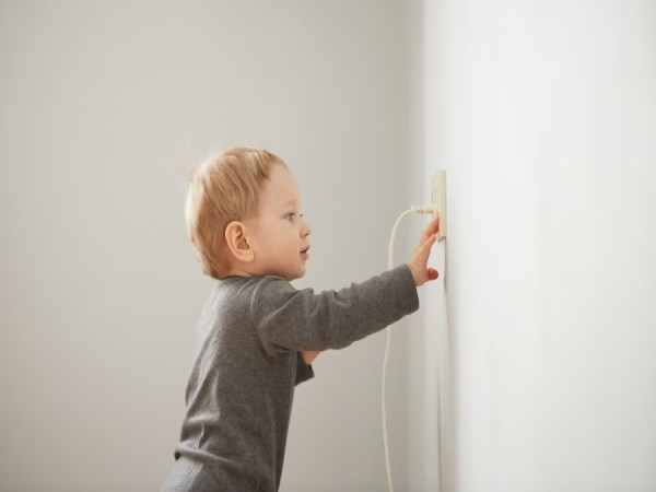child playing with socket