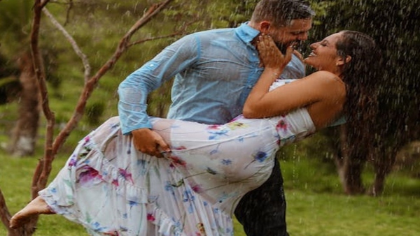 couple physical intimacy in rain