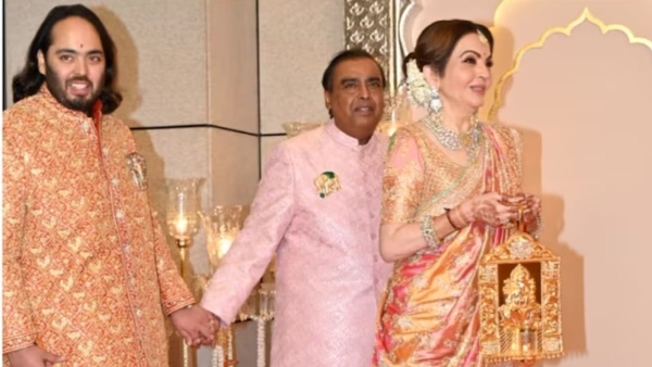 Nita Ambani carries a Raman Divo at son s wedding