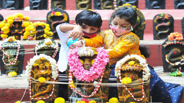 Nag Panchami Rituals Why do people draw snakes at entrance of the house Know Reason in Hindi