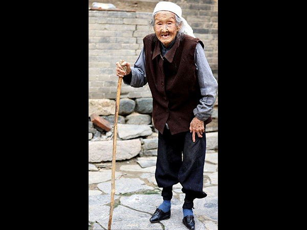An old lady subjected to brutal tradition of feet binding