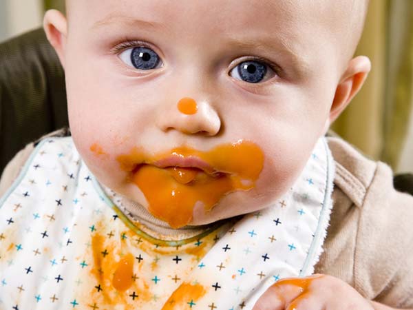baby spits up after feeding