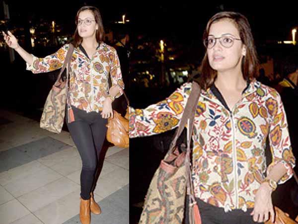 Dia Mirza flaunting tan boots at the airport