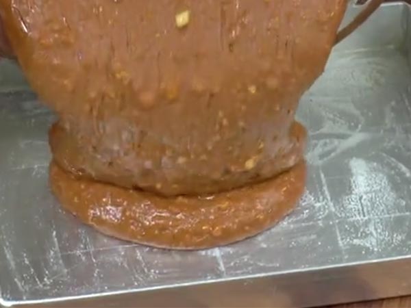 Use your hands to grease it well.