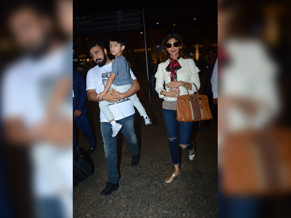 celebrities wearing distressed jeans at airport