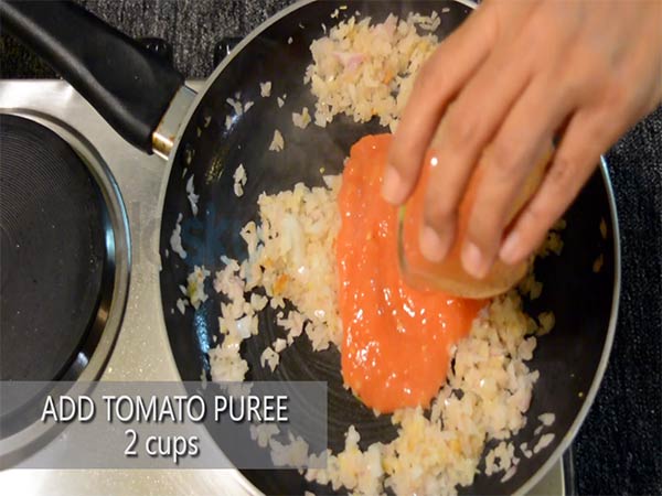 1. Add 2 tablespoons of olive oil to a heated pan. 2. Add the chopped garlic cloves and fry it for half a minute. 3. Add the finely chopped onion and saute for a minute. 4. Then, add 2 cups of tomato puree and saute again for 3 to 4 minutes, until the tomato juice evaporates. 5. Add a teaspoon of salt and 2 teaspoons of red chilli powder. 6. Add 2 teaspoons of mixed herbs and half a cup of ketchup or tomato sauce. Mix well. 7. Saute for 3-4 minutes. 8. Turn off the stove and this can be used as per your preference.