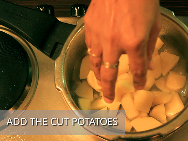  STEP BY STEP – HOW TO MAKE ALOO MUTTER GRAVY 1. Add a tablespoon of oil in a heated pan. 2. Add the chopped onions. 3. Sauté well until it turns to golden brown in colour. 4. Add the cut tomatoes and sauté continuously for a minute to avoid it from burning. 5. Add the grated ginger and 4 garlic cloves. 6. Add the chopped green chillies and sauté well for a minute. 7. It is done once the skin of the tomatoes starts to peel off. 8. Allow it to cool for 10 minutes. 9. Meanwhile, take 3 washed potatoes and peel the skin off. 10. Further, cut it into cubes. Keep it aside. 11. Add the sautéed mixture in a mixer jar. 12. Grind it into a smooth paste. Keep it aside. 13. Now, add 2½ tablespoons of oil in a heated pressure cooker. 14. Add jeera and allow it to splutter. 15. Add the cut potatoes and stir well. Let it cook for a minute. 16. Add the ground paste and mix it well. 17. Then, add salt and turmeric powder. 18. Add red chilli powder and dhaniya powder to spice up the dish. Mix well. 19. Add the green peas and mix it again. 20. Further, add a cup of water. 21. Close the lid and pressure cook it for upto 3 whistles. 22. Once done, take it off the stove and allow the pressure to settle. 23. Now, open the lid and add garam masala and jeera powder to it. 24. Finally, garnish it with coriander leaves. 25. Serve hot.