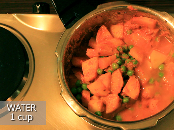  STEP BY STEP – HOW TO MAKE ALOO MUTTER GRAVY 1. Add a tablespoon of oil in a heated pan. 2. Add the chopped onions. 3. Sauté well until it turns to golden brown in colour. 4. Add the cut tomatoes and sauté continuously for a minute to avoid it from burning. 5. Add the grated ginger and 4 garlic cloves. 6. Add the chopped green chillies and sauté well for a minute. 7. It is done once the skin of the tomatoes starts to peel off. 8. Allow it to cool for 10 minutes. 9. Meanwhile, take 3 washed potatoes and peel the skin off. 10. Further, cut it into cubes. Keep it aside. 11. Add the sautéed mixture in a mixer jar. 12. Grind it into a smooth paste. Keep it aside. 13. Now, add 2½ tablespoons of oil in a heated pressure cooker. 14. Add jeera and allow it to splutter. 15. Add the cut potatoes and stir well. Let it cook for a minute. 16. Add the ground paste and mix it well. 17. Then, add salt and turmeric powder. 18. Add red chilli powder and dhaniya powder to spice up the dish. Mix well. 19. Add the green peas and mix it again. 20. Further, add a cup of water. 21. Close the lid and pressure cook it for upto 3 whistles. 22. Once done, take it off the stove and allow the pressure to settle. 23. Now, open the lid and add garam masala and jeera powder to it. 24. Finally, garnish it with coriander leaves. 25. Serve hot.
