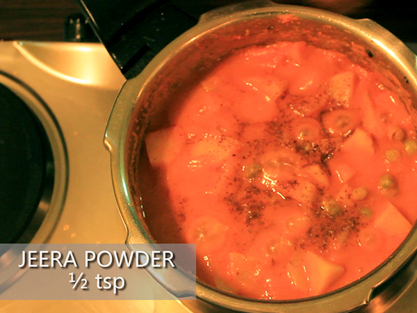  STEP BY STEP – HOW TO MAKE ALOO MUTTER GRAVY 1. Add a tablespoon of oil in a heated pan. 2. Add the chopped onions. 3. Sauté well until it turns to golden brown in colour. 4. Add the cut tomatoes and sauté continuously for a minute to avoid it from burning. 5. Add the grated ginger and 4 garlic cloves. 6. Add the chopped green chillies and sauté well for a minute. 7. It is done once the skin of the tomatoes starts to peel off. 8. Allow it to cool for 10 minutes. 9. Meanwhile, take 3 washed potatoes and peel the skin off. 10. Further, cut it into cubes. Keep it aside. 11. Add the sautéed mixture in a mixer jar. 12. Grind it into a smooth paste. Keep it aside. 13. Now, add 2½ tablespoons of oil in a heated pressure cooker. 14. Add jeera and allow it to splutter. 15. Add the cut potatoes and stir well. Let it cook for a minute. 16. Add the ground paste and mix it well. 17. Then, add salt and turmeric powder. 18. Add red chilli powder and dhaniya powder to spice up the dish. Mix well. 19. Add the green peas and mix it again. 20. Further, add a cup of water. 21. Close the lid and pressure cook it for upto 3 whistles. 22. Once done, take it off the stove and allow the pressure to settle. 23. Now, open the lid and add garam masala and jeera powder to it. 24. Finally, garnish it with coriander leaves. 25. Serve hot.