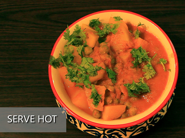  STEP BY STEP – HOW TO MAKE ALOO MUTTER GRAVY 1. Add a tablespoon of oil in a heated pan. 2. Add the chopped onions. 3. Sauté well until it turns to golden brown in colour. 4. Add the cut tomatoes and sauté continuously for a minute to avoid it from burning. 5. Add the grated ginger and 4 garlic cloves. 6. Add the chopped green chillies and sauté well for a minute. 7. It is done once the skin of the tomatoes starts to peel off. 8. Allow it to cool for 10 minutes. 9. Meanwhile, take 3 washed potatoes and peel the skin off. 10. Further, cut it into cubes. Keep it aside. 11. Add the sautéed mixture in a mixer jar. 12. Grind it into a smooth paste. Keep it aside. 13. Now, add 2½ tablespoons of oil in a heated pressure cooker. 14. Add jeera and allow it to splutter. 15. Add the cut potatoes and stir well. Let it cook for a minute. 16. Add the ground paste and mix it well. 17. Then, add salt and turmeric powder. 18. Add red chilli powder and dhaniya powder to spice up the dish. Mix well. 19. Add the green peas and mix it again. 20. Further, add a cup of water. 21. Close the lid and pressure cook it for upto 3 whistles. 22. Once done, take it off the stove and allow the pressure to settle. 23. Now, open the lid and add garam masala and jeera powder to it. 24. Finally, garnish it with coriander leaves. 25. Serve hot.