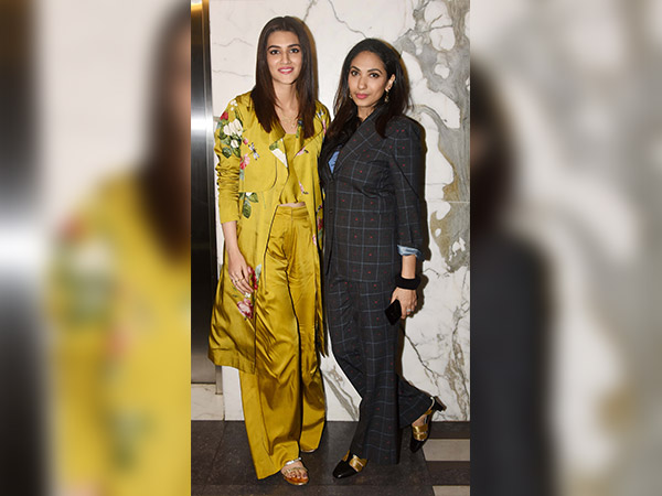 nidhhi agerwal and kriti sanon wearing satin outfits at padman screening