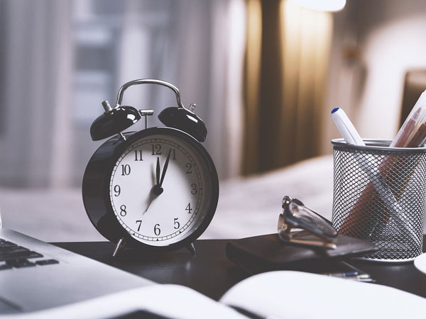 3. Keep Your Alarm Away From Your Bed