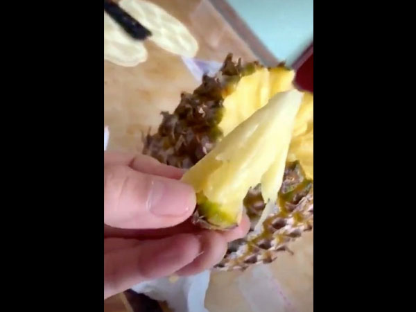 eating pineapple