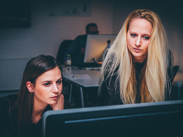 Colleagues helping each other