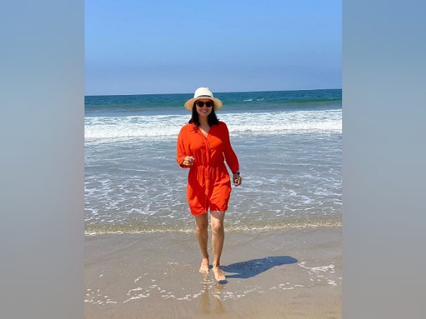 Sunny Leone In An Orange Jumpsuit