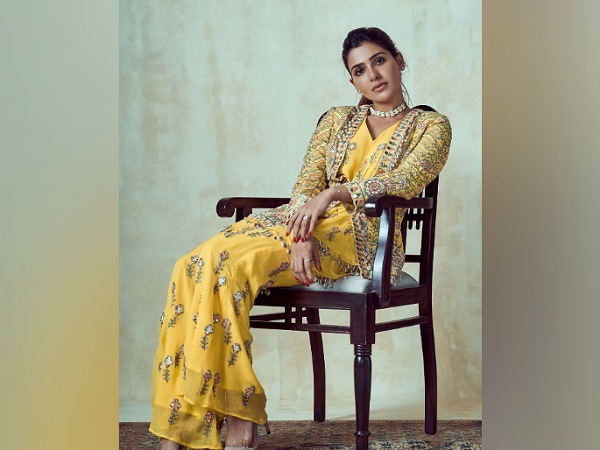 South star Samantha Akkineni is not among the actresses who would have fashion photoshoots every now and then but whenever she has one, she makes sure all eyes are on her. After a long time, recently, the actress treated us with her gorgeous look from her latest photoshoot and shared pictures on her Instagram feed. Dressed in a beautiful yellow ethnic ensemble with intricately embroidered jacket, Samantha exuded diva vibes. So, let us take a close look at her attire and decode it. So, Samantha Akkineni was dressed up in a V-shaped neckline full-length yellow ensemble, which was designed by Arpita Mehta. Her outfit was accentuated by intricate green-hued leaf patterns and white crystal detailing. She layered it with a full-sleeved open-front heavily embroidered matching jacket that featured multi-hued floral patterns and mostly myriad green-hued patterns. The Oh! Baby actress completed her look with a pair of beige-hued heels and accessorised her look with silver-toned studs, a pretty necklace, a bracelet, and a few rings. She painted her nails redto notch up her look. On the makeup front, minimal base marked by sharply contoured and highlighted face and jawline, spruced up her look. Filled thick brows, kohled eyes, heavy mascara, curled lashes, soft blush, and pink lip shade rounded out her look. The Majili actress pulled back her poofy tresses into a neat ponytail and looked elegant. We really liked this yellow ethnic outfit of Samantha Akkineni and it seemed perfect for sangeet functions. What do you think about it? Let us know that in the comment section.