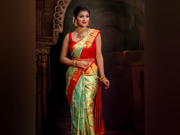Yashika Aannand In An Orange And Green Silk Saree