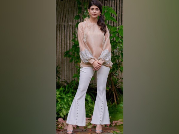 Sanjana Sanghi In A Peach Top And White Jeans