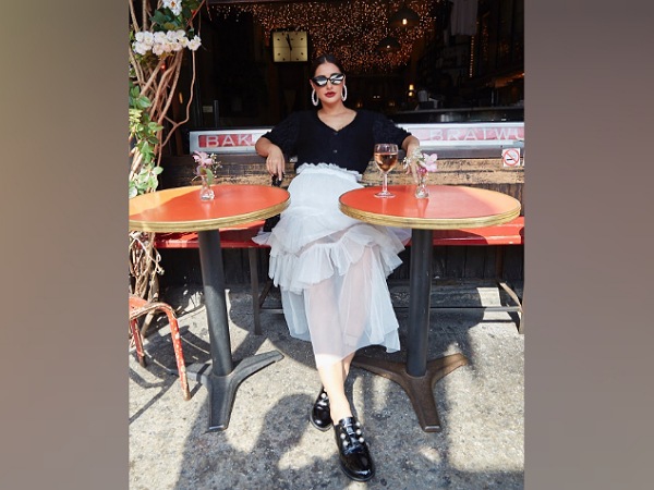 Nargis Fakhri In A Black Top And White Skirt