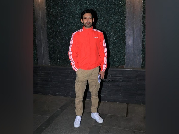 Vikrant Massey In An Orange Jacket And Beige Trousers