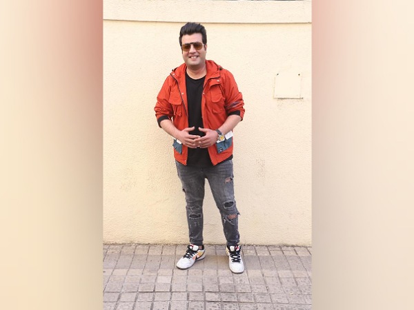 Varun Sharma In An Orange Jacket And Distressed Jeans