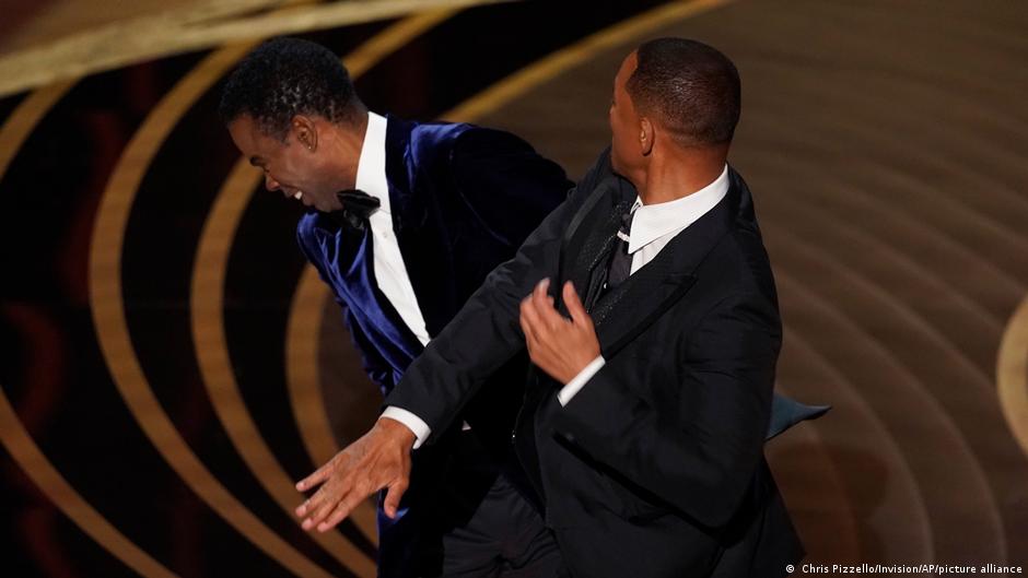 Will Smith struck Chris Rock with an open palm after Rock made a quip about Smiths wifes hair