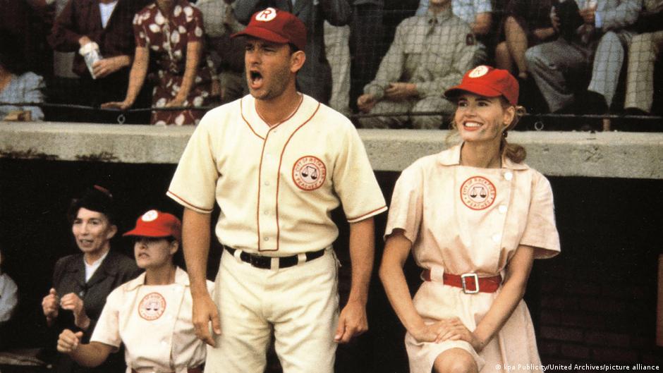 Tom Hanks (l) played Jimmy Dugan, the coach of womens team with Geena Davis (r) playing the teams catcher