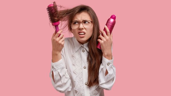 7 Simple Tricks To Tame Frizzy Hair