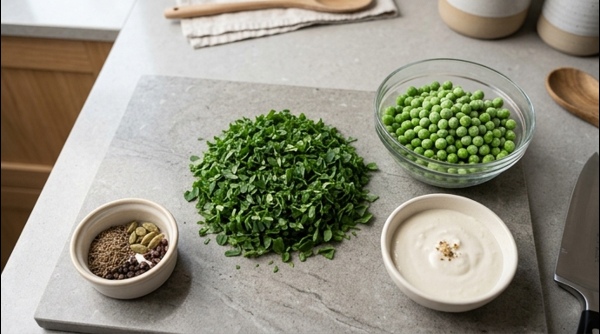 Sautéing white cashew and onion paste in a modern stainless steel pan
