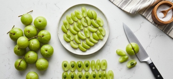 Fresh green amla fruits being steamed in a modern stainless steel steamer