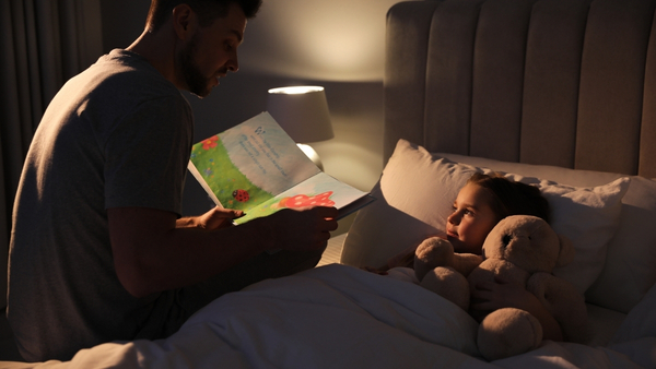 dad reading story to child