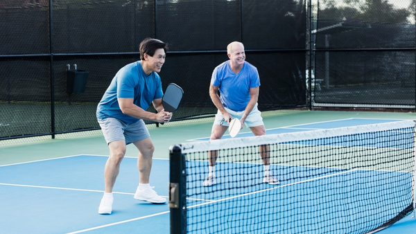 old people playing pickleball old people playing pickleball