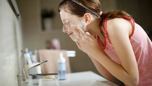teenager washing face teenager washing face