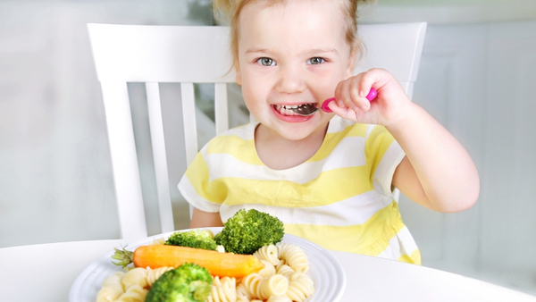 child eating healthy food