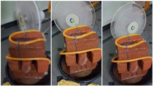 Man Crafts Traditional Cooler Using Table Fan And Bricks In Home