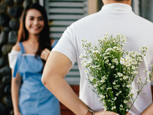 man hold flower