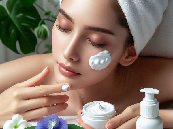 woman applying cream on face