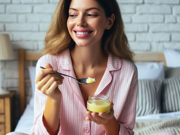 Woman having one spoon of ghee