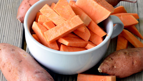 Eating Boiled Sweet Potato