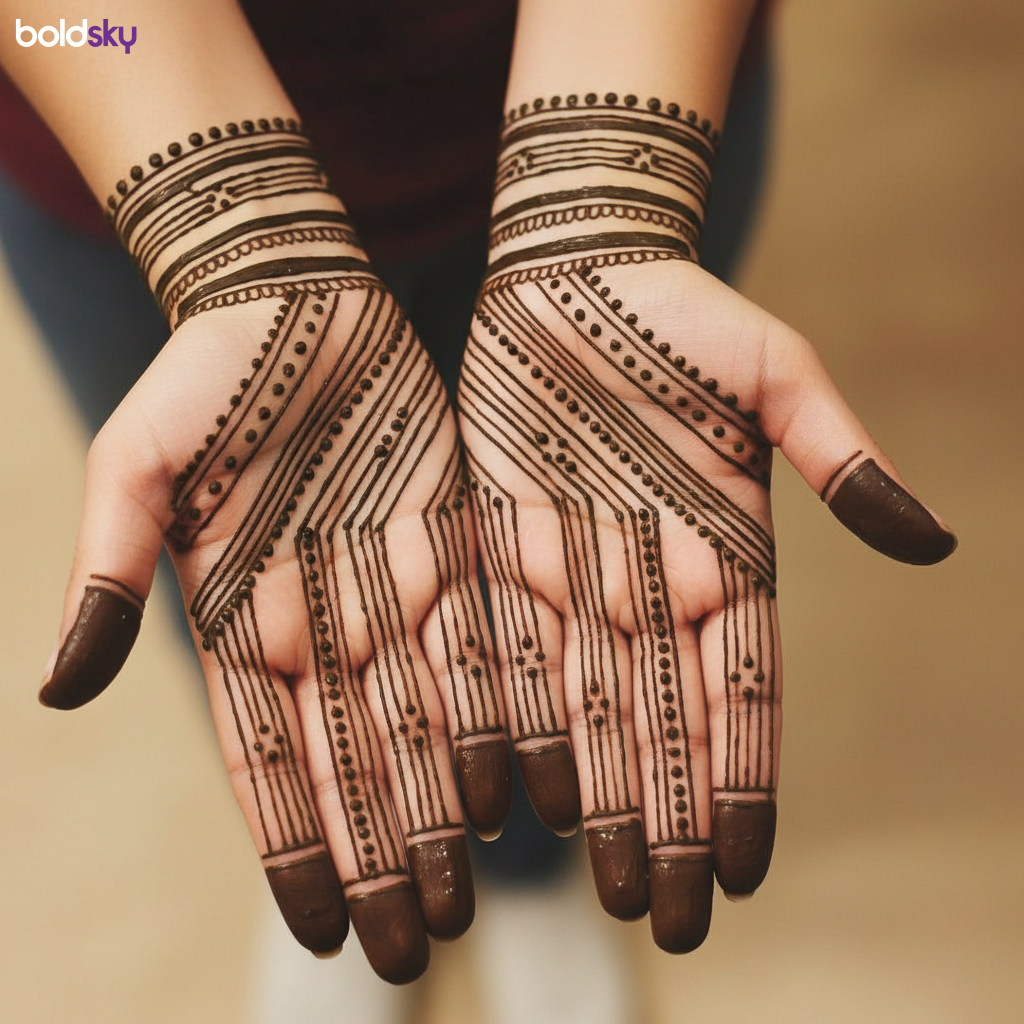 Front of hands with geometric mehndi bands.