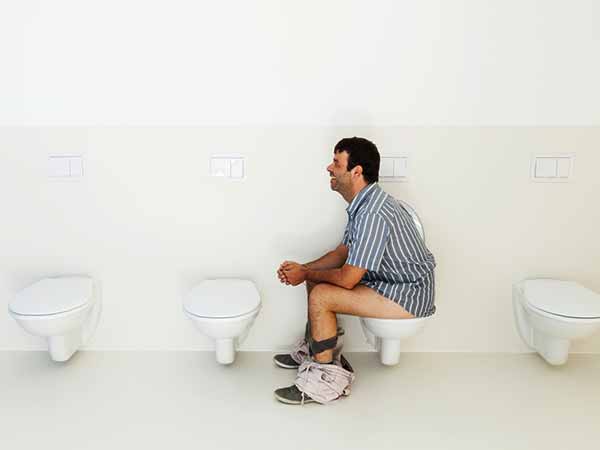Why is sitting on a toilet for a long time bad in tamil