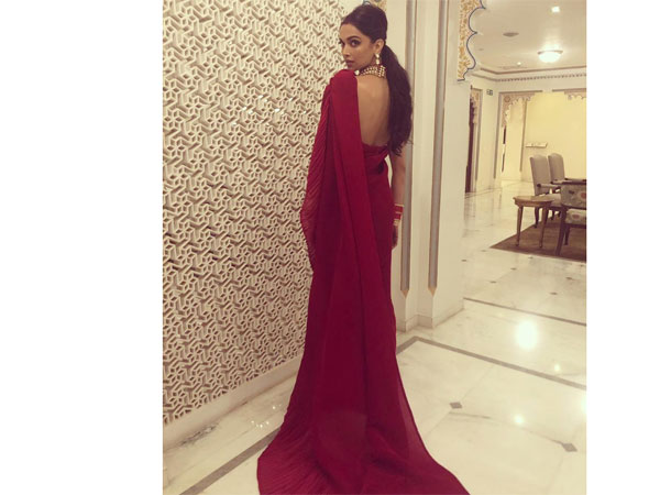 Deepika Padukones Contemporary Red Sari Should Be Your Next Cocktail Party Wear Deepika Padukones Contemporary Red Sari Should Be Your Next Cocktail Party Wear