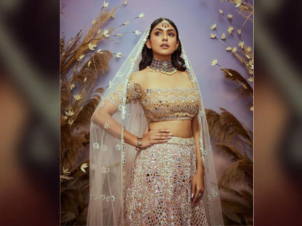Sita ramam fame mrunal thakur looks stunning in her latest golden lehenga and other pics