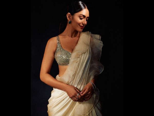 Sita ramam fame mrunal thakur looks stunning in her latest golden lehenga and other pics