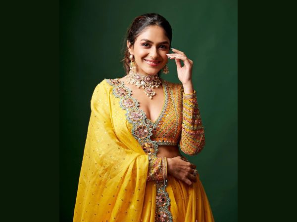 Sita ramam fame mrunal thakur looks stunning in her latest golden lehenga and other pics