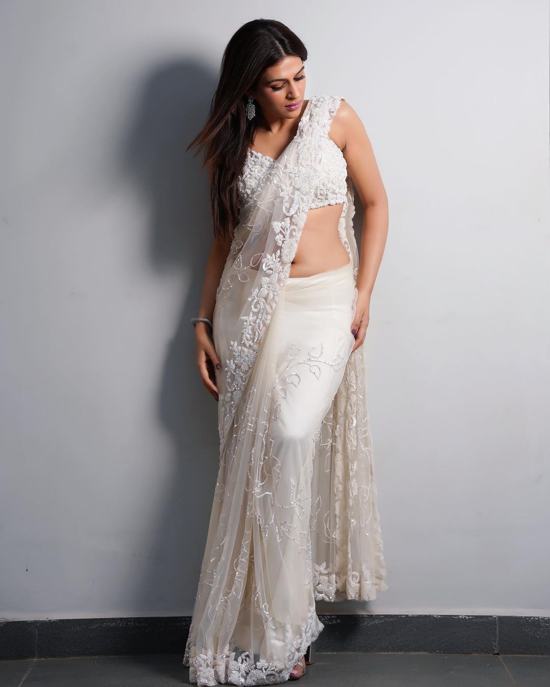 Actress Shraddha Das Mesmerizing Stills In White Color Saree