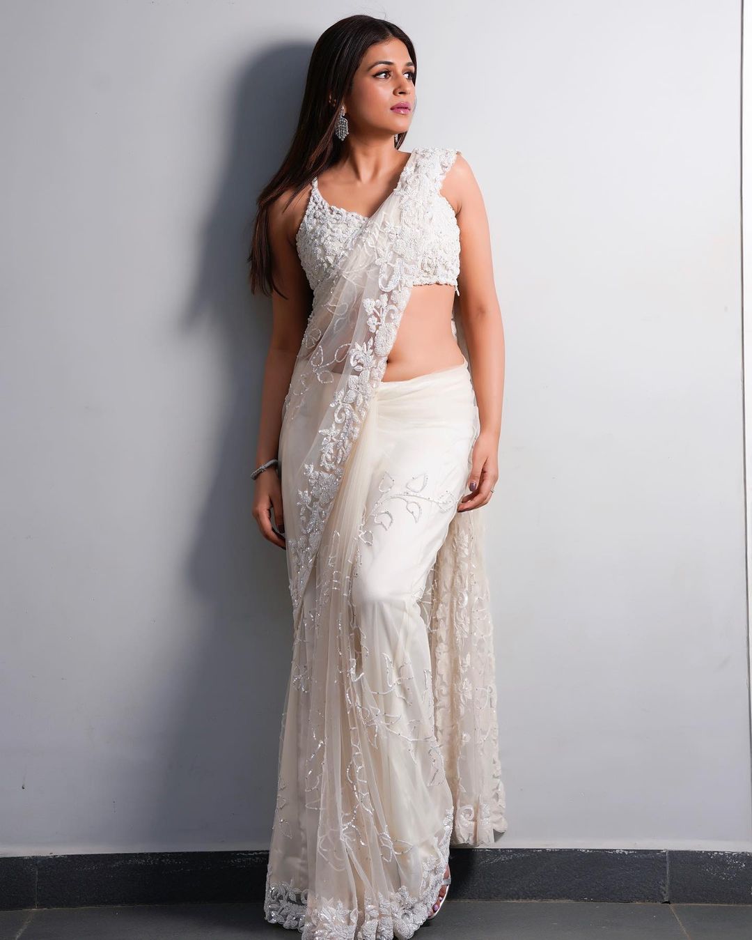 Actress Shraddha Das Mesmerizing Stills In White Color Saree