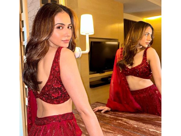 Actress Rakul Preet Singh Glamorous Stills In Maroon Lehenga